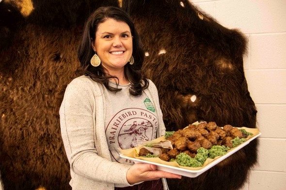 Chelsea Davis of Prairiebird Pastures holds a plate of meatballs.