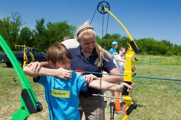 Youth practices archery at JAKES event