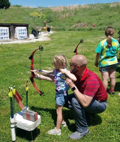 Dad and daughter archery