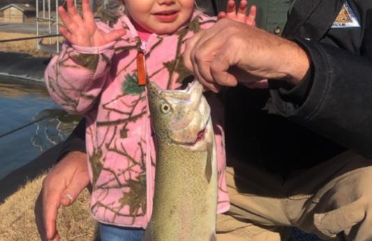 Girl with rainbow trout