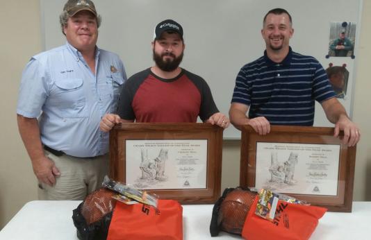 MDC Forester Gary Gognat with Loggers of the Year Chesley and Robert Neal of Winona.