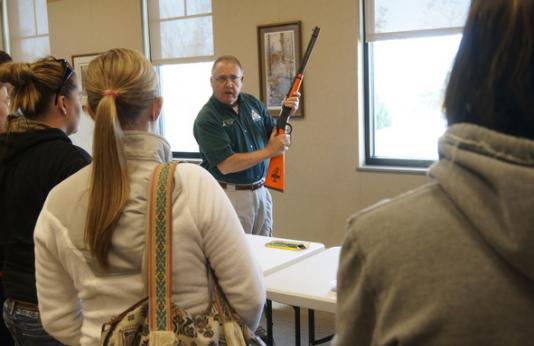 Hunter Education instructor teaching a class about gun safety.