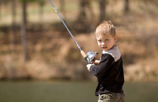Little boy fishing.