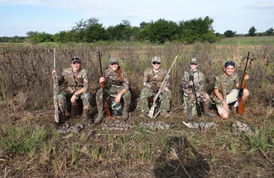 Youth hunters posing with their harvested doves.