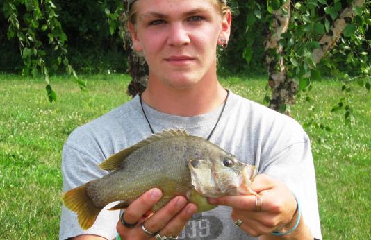 Bowen Dockery holding his new state-record green sunfish.