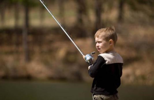 Little boy fishing.