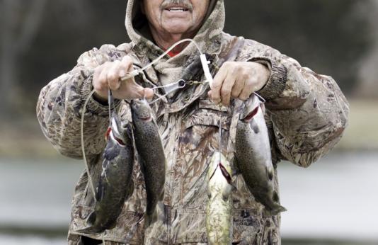 A trout angler shows off his catch