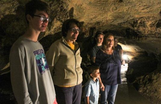 A family visits Stark Caverns in Eldon.