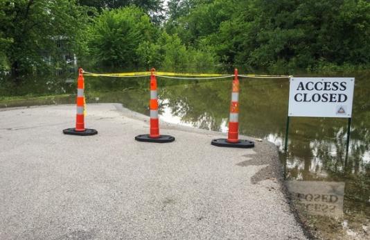 A river access closed by flooding.