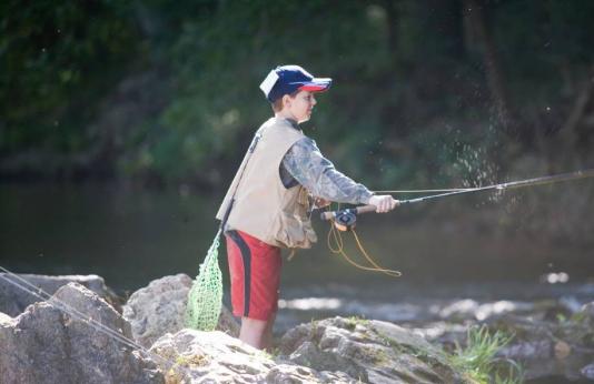 A young boy casts his line at a Missouri fishing spot.